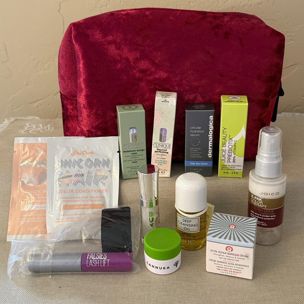 Beautiful cranberry red crushed velvet bag with hair, skin and make-up products